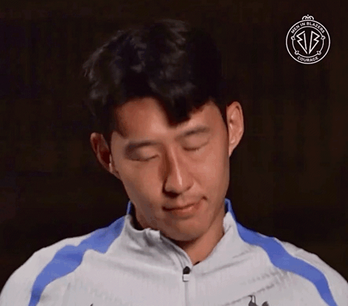 A Man With His Eyes Closed Is Wearing A Jacket That Says Made In Blazers GIF