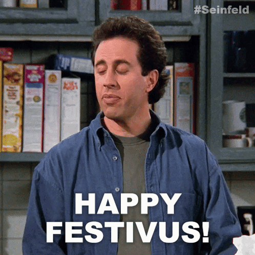 A Man With His Eyes Closed Says " Happy Festivus " GIF