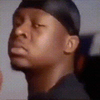 a man with his eyes closed wearing a bandana