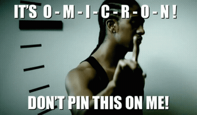 A Man With His Finger On His Lips And The Words " It 'S O-M-I-C-R-O-N ! " GIF