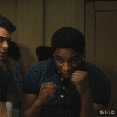 A Man With His Fist In The Air And A Netflix Logo In The Corner GIF