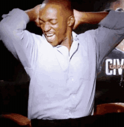 A Man With His Hands Behind His Head Is Wearing A Shirt That Says Civ GIF