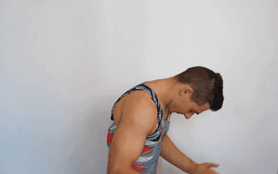 A Man With His Hands Folded In Front Of His Chest GIF