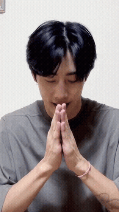 A Man With His Hands Folded In Prayer . GIF
