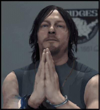 A Man With His Hands Folded Praying In Front Of A Sign That Says Ridges GIF