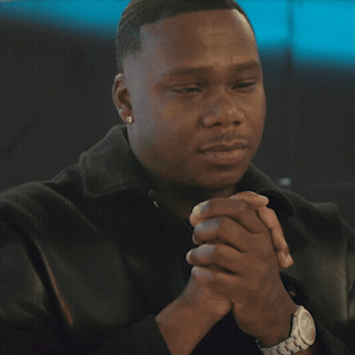 A Man With His Hands Folded Wearing A Silver Watch GIF