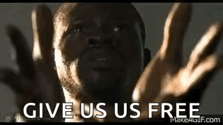 A Man With His Hands Outstretched And The Words `` Give Us Us Free '' Written On His Face . GIF