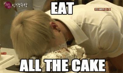 A Man With His Head On A Cake With The Words Eat All The Cake Below Him GIF