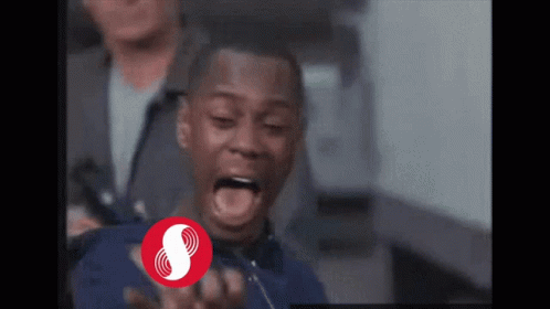 A Man With His Mouth Open And A Red Circle With The Letter S In It GIF