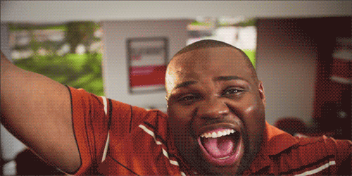 A Man With His Mouth Open And His Arms In The Air GIF