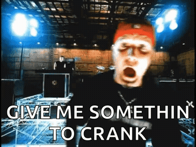 A Man With His Mouth Open And The Words Give Me Somethin To Crank Behind Him GIF