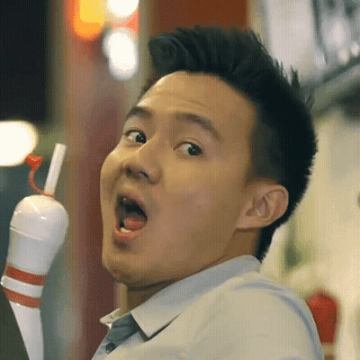 A Man With His Mouth Open Holds A Bowling Pin In His Hand GIF