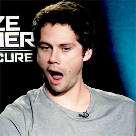 A Man With His Mouth Open In Front Of A Maze Runner Advertisement GIF