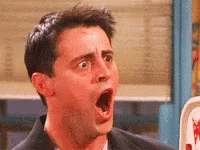A Man With His Mouth Open Is Making A Funny Face . GIF