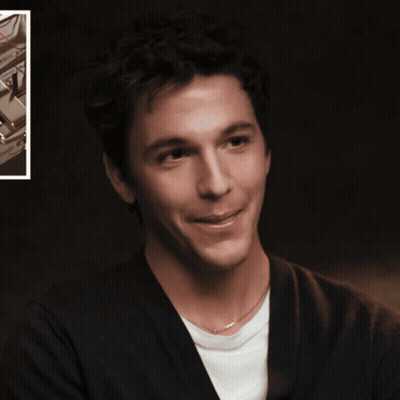 A Man With His Tongue Hanging Out Is Smiling GIF