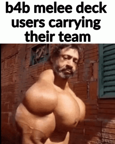 A Man With Huge Muscles Is Standing In Front Of A Brick Wall GIF