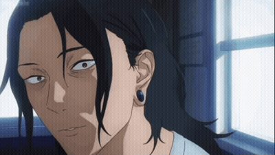 A Man With Long Black Hair And Blue Earrings Is Looking Out Of A Window . GIF