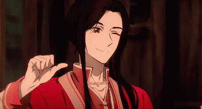 A Man With Long Black Hair Is Giving A Thumbs Up GIF