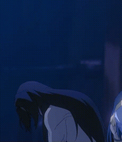 A Man With Long Black Hair Is Standing In A Dark Room With His Arms Outstretched GIF