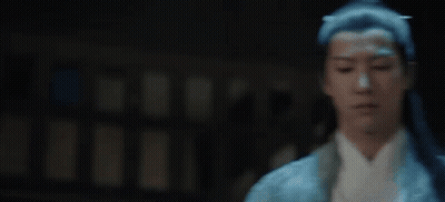A Man With Long Black Hair Is Wearing A Blue And White Kimono . GIF