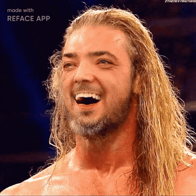 A Man With Long Blonde Hair And A Beard Is Smiling With The Reface App GIF