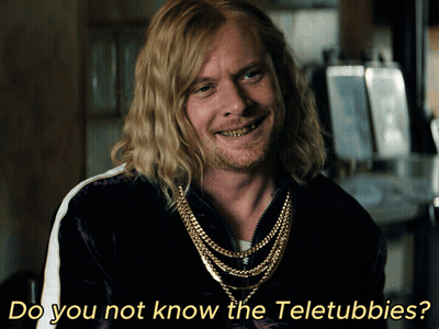 A Man With Long Blonde Hair And A Beard Is Smiling With The Words Do You Not Know The Teletubbies Below Him GIF