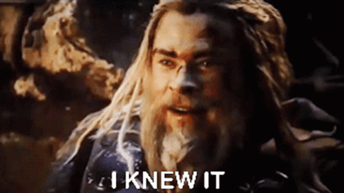 A Man With Long Blonde Hair And A Beard Is Standing In Front Of A Rock And Says `` I Knew It '' . GIF
