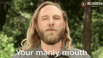 A Man With Long Blonde Hair And A Beard Says Your Manly Mouth GIF