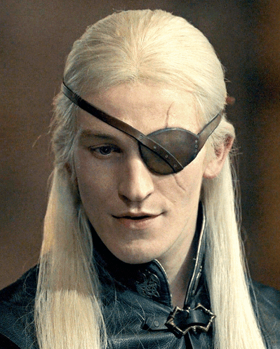 A Man With Long Blonde Hair Has A Brown Eye Patch On His Forehead GIF