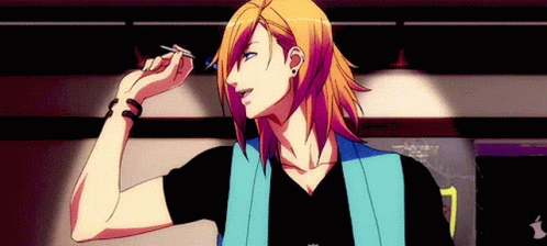 A Man With Long Blonde Hair Is Holding A Dart In His Right Hand GIF