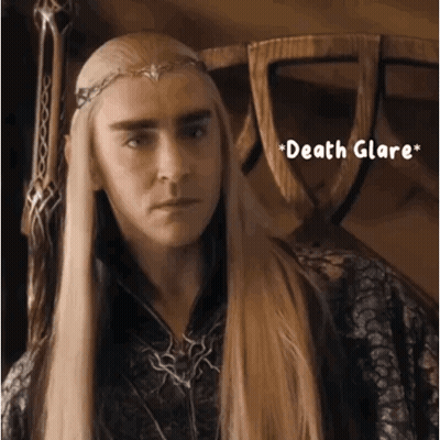 A Man With Long Blonde Hair Is Wearing A Crown And The Words Death Glare GIF