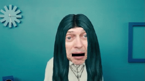 A Man With Long Blue Hair And A Black Stripe In His Mouth GIF