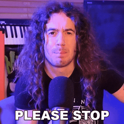 A Man With Long Curly Hair Is Talking Into A Microphone And Saying Please Stop . GIF