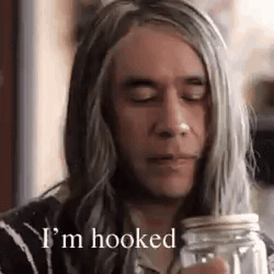A Man With Long Gray Hair Is Drinking From A Mason Jar And Saying `` I 'M Hooked '' . GIF
