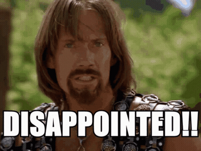 A Man With Long Hair And A Beard Has Disappointed On His Face GIF