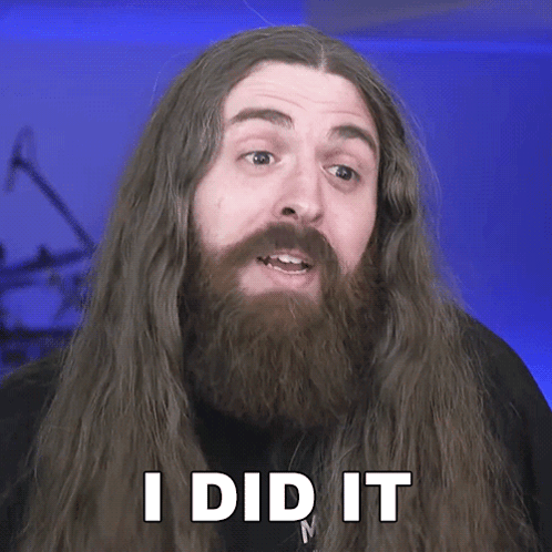 un hombre de pelo largo y barba tiene las palabras lo hice en su cara GIF