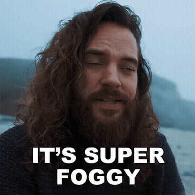 A Man With Long Hair And A Beard Has The Words It 'S Super Foggy Above Him GIF