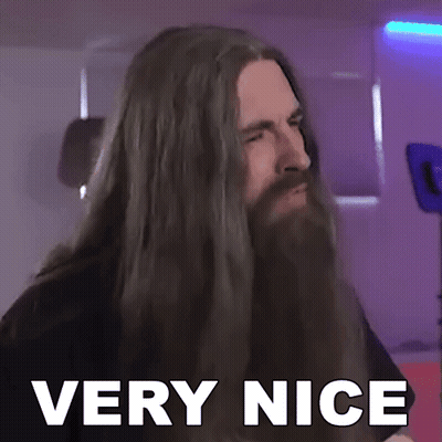 A Man With Long Hair And A Beard Has The Words Very Nice On His Face GIF