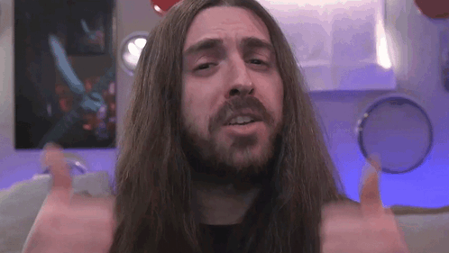 Man With Long Hair And Beard Giving Thumbs Up GIF