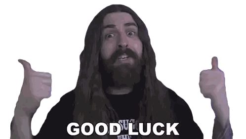 A Man With Long Hair And A Beard Is Giving A Thumbs Up With The Words Good Luck Written Below Him Sticker