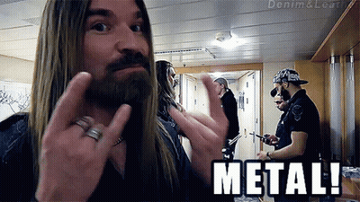 A Man With Long Hair And A Beard Is Giving The Middle Finger And The Word Metal Is Below Him GIF