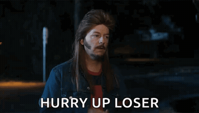 A Man With Long Hair And A Beard Is Giving The Middle Finger And The Words Hurry Up Loser Are Below Him GIF