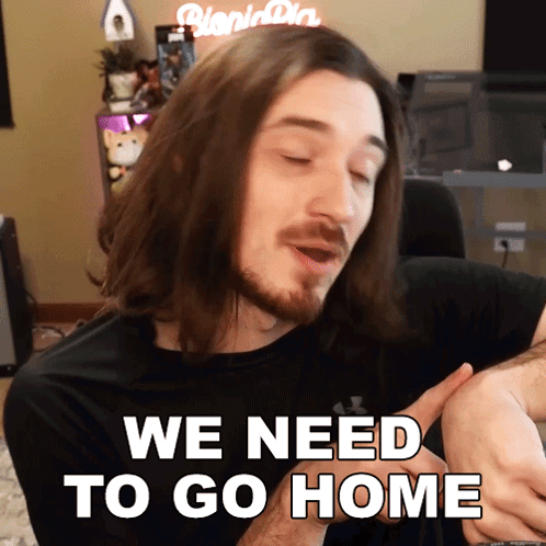 A Man With Long Hair And A Beard Is Holding A Baby And Says We Need To Go Home GIF