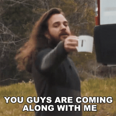 A Man With Long Hair And A Beard Is Holding A Cup Of Coffee And Saying You Guys Are Coming Along With Me GIF