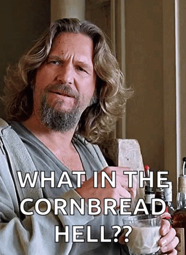 A Man With Long Hair And A Beard Is Holding A Glass Of Milk And Says What In The Cornbread Hell ? GIF