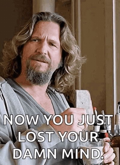 A Man With Long Hair And A Beard Is Holding A Glass With The Words Now You Just Lost Your Damn Mind Below Him GIF