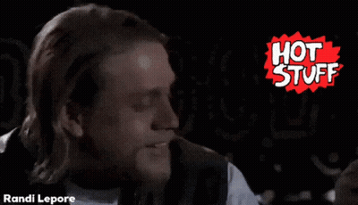 A Man With Long Hair And A Beard Is In Front Of A Hot Stuff Logo GIF