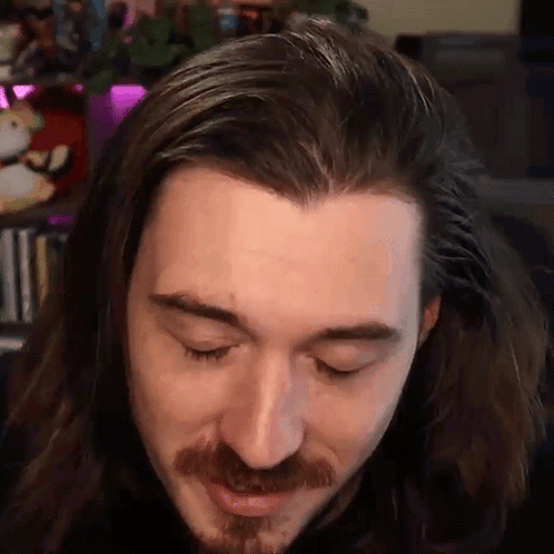 Man With Long Hair And Beard Looking Down GIF