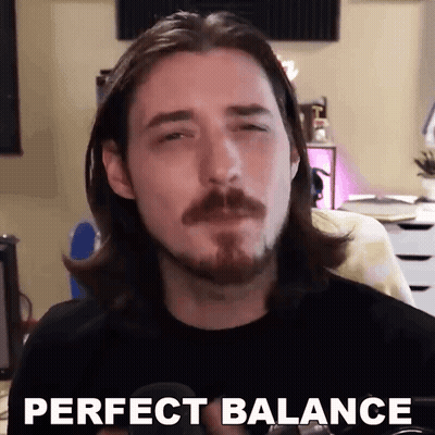 A Man With Long Hair And A Beard Is Making A Funny Face And Saying `` Perfect Balance '' . GIF