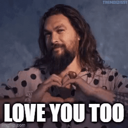 A Man With Long Hair And A Beard Is Making A Heart Shape With His Hands And Says `` Love You Too '' . GIF
